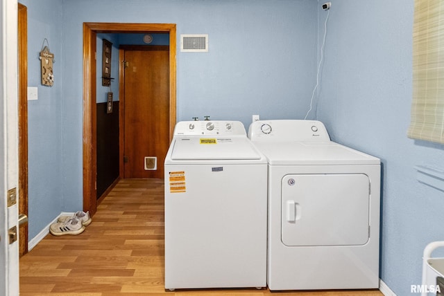 203 E 2nd St, Sparta, IL 62286 - washroom with independent washer and dryer, light wood-style flooring, and baseboards