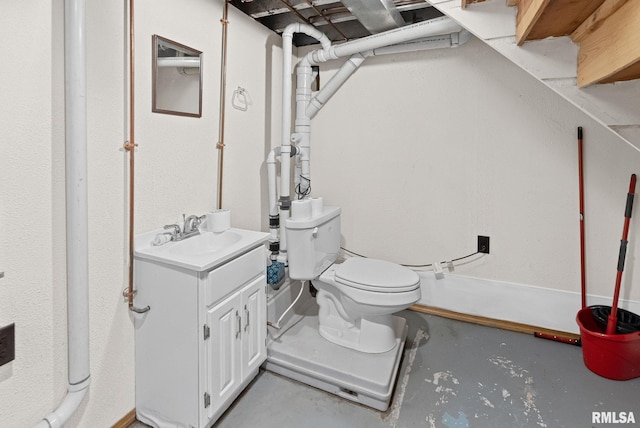 203 E 2nd St, Sparta, IL 62286 - half bathroom featuring vanity, toilet, and concrete flooring