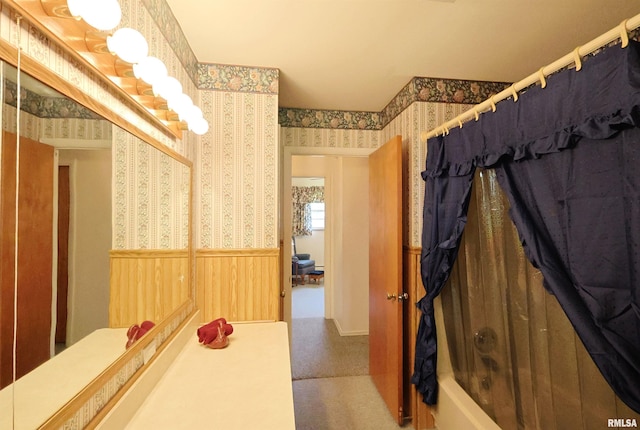 914 Meadow Ln, Salem, IL 62881 - bathroom with wallpapered walls, a wainscoted wall, and shower / bath combo