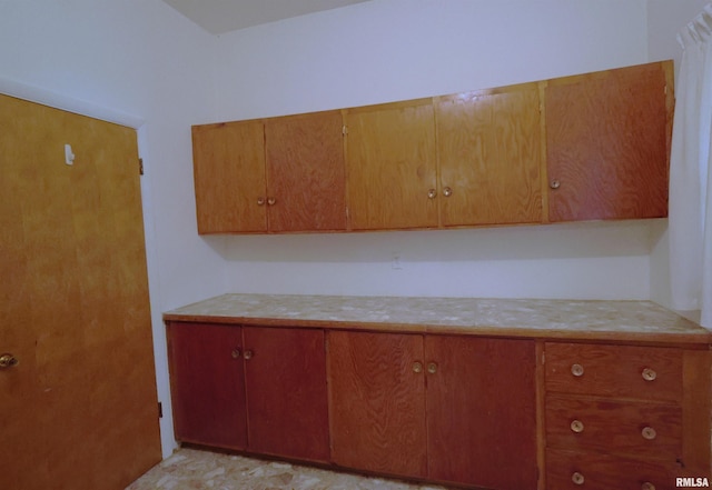 914 Meadow Ln, Salem, IL 62881 - kitchen with light countertops and brown cabinetry