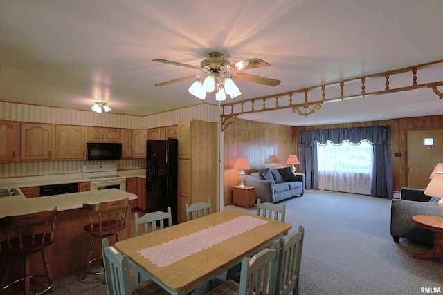 914 Meadow Ln, Salem, IL 62881 - dining space featuring dark colored carpet and ceiling fan
