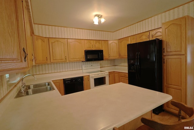 914 Meadow Ln, Salem, IL 62881 - kitchen featuring black appliances, a sink, wallpapered walls, light brown cabinetry, and light countertops