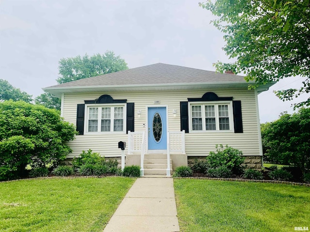 1301 N State St, Marion, IL 62959 - bungalow-style house with a front lawn and a chimney