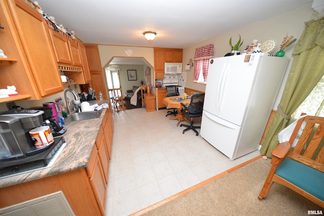 12522 N Dartmouth Ln, Mount Vernon, IL 62864 - kitchen with white appliances, arched walkways, a sink, light floors, and open shelves