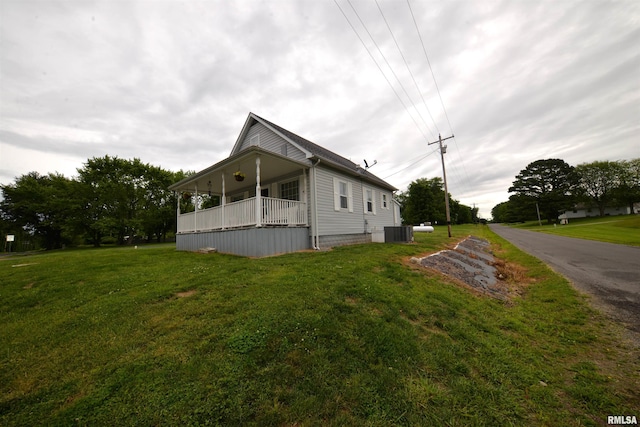 12522 N Dartmouth Ln, Mount Vernon, IL 62864 - view of home's exterior featuring cooling unit and a lawn