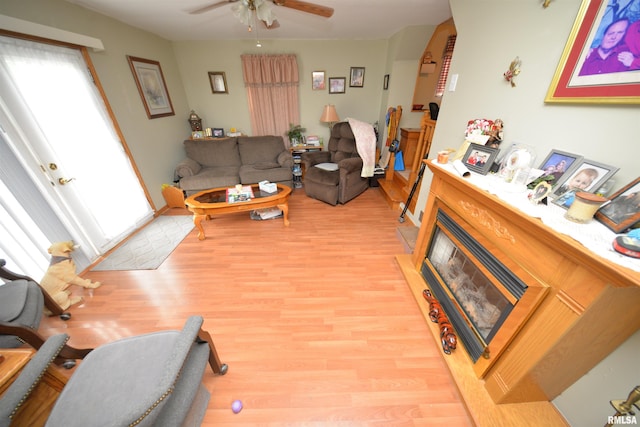 12522 N Dartmouth Ln, Mount Vernon, IL 62864 - living room featuring light wood-style floors, ceiling fan, and a glass covered fireplace