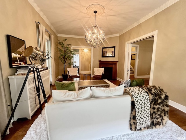 212 E 3rd St, Metropolis, IL 62960 - living area featuring a chandelier, baseboards, ornamental molding, a fireplace, and dark wood-style flooring