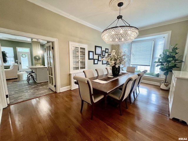 212 E 3rd St, Metropolis, IL 62960 - dining area with dark wood-style floors, a chandelier, plenty of natural light, and ornamental molding
