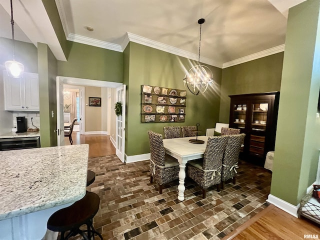 212 E 3rd St, Metropolis, IL 62960 - dining room with baseboards, a chandelier, brick floors, ornamental molding, and beverage cooler