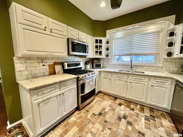 212 E 3rd St, Metropolis, IL 62960 - kitchen with appliances with stainless steel finishes, a sink, white cabinets, and recessed lighting
