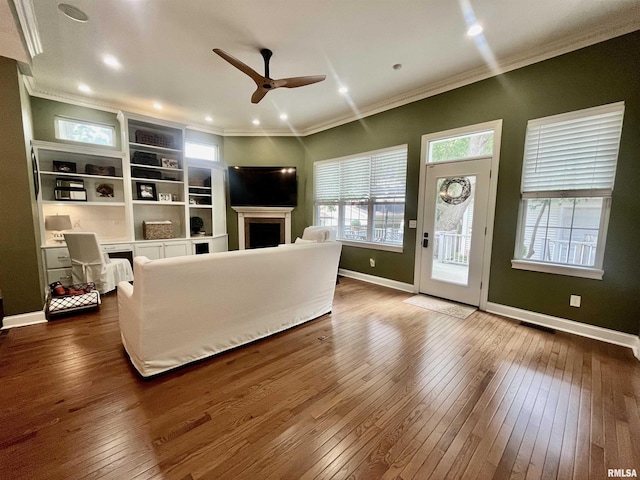 212 E 3rd St, Metropolis, IL 62960 - living room featuring a ceiling fan, dark wood-style flooring, ornamental molding, a fireplace, and baseboards