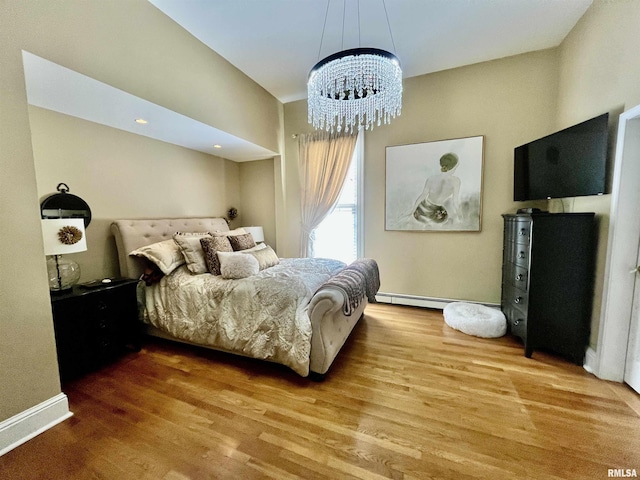 212 E 3rd St, Metropolis, IL 62960 - bedroom featuring wood finished floors and a chandelier