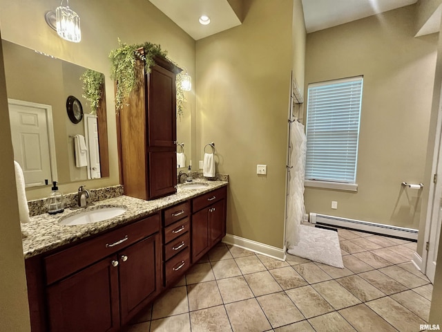 212 E 3rd St, Metropolis, IL 62960 - full bathroom featuring a baseboard radiator, double vanity, tile patterned flooring, and baseboards
