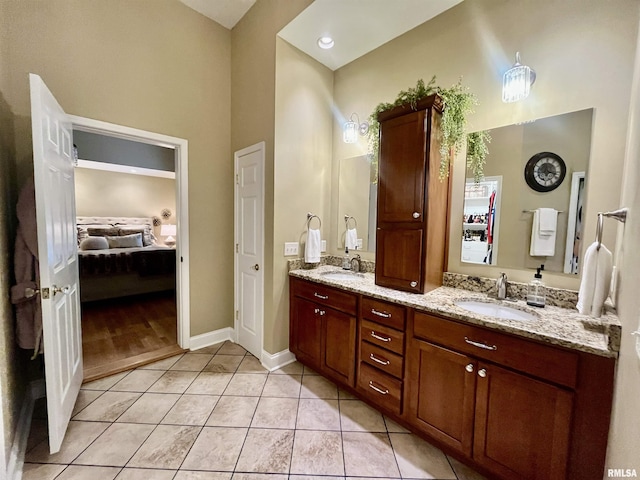 212 E 3rd St, Metropolis, IL 62960 - full bath with ensuite bathroom, double vanity, tile patterned flooring, and baseboards