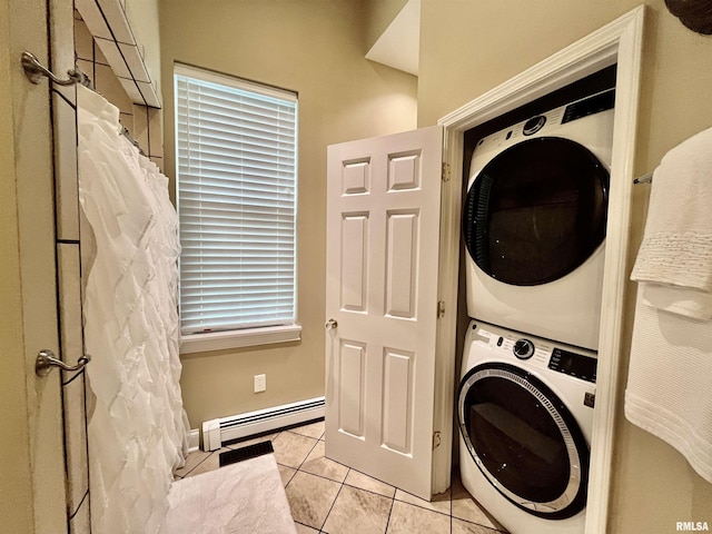 212 E 3rd St, Metropolis, IL 62960 - washroom with stacked washing machine and dryer, baseboard heating, and light tile patterned flooring