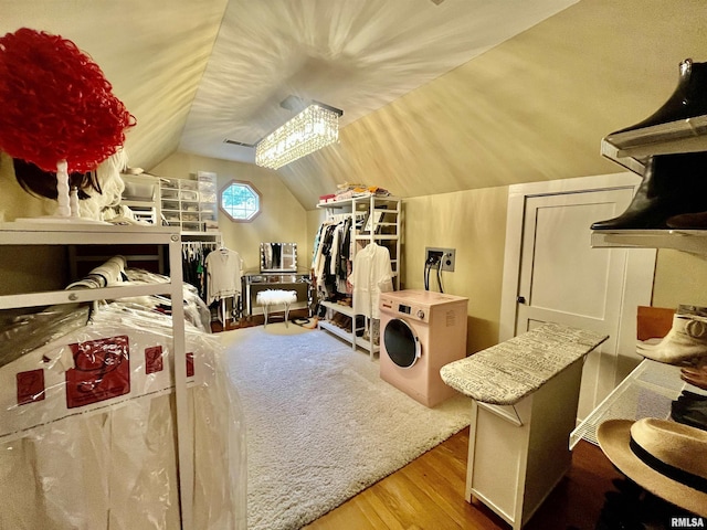 212 E 3rd St, Metropolis, IL 62960 - bedroom featuring washer / clothes dryer, wood finished floors, and lofted ceiling