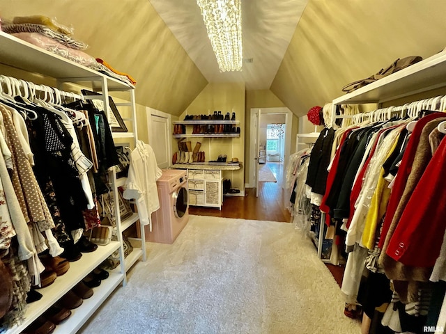 212 E 3rd St, Metropolis, IL 62960 - walk in closet with washer / clothes dryer, lofted ceiling, wood finished floors, and a chandelier