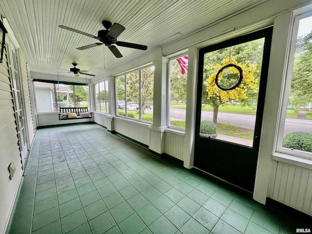 212 E 3rd St, Metropolis, IL 62960 - unfurnished sunroom featuring a ceiling fan and plenty of natural light