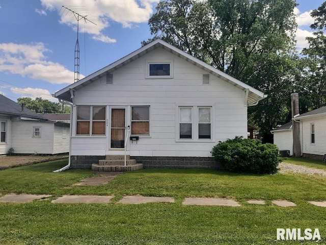504 W Sylvester Ave, Christopher, IL 62822 - rear view of house with a yard and entry steps