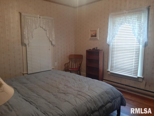 504 W Sylvester Ave, Christopher, IL 62822 - bedroom featuring wood finished floors and wallpapered walls