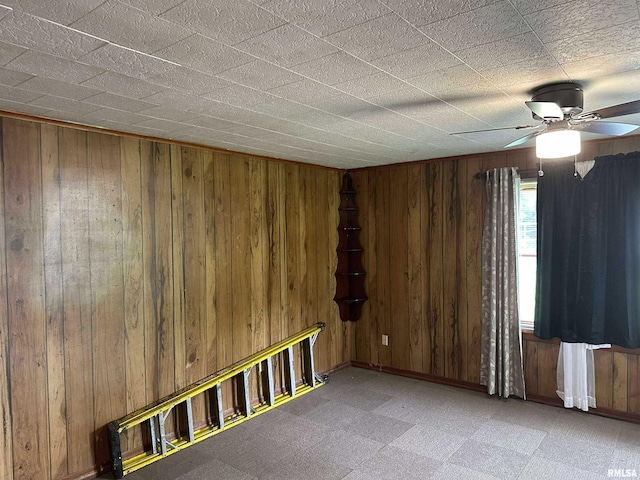 1502 N 13th St, Herrin, IL 62948 - unfurnished room featuring ceiling fan, wooden walls, tile patterned floors, and baseboards