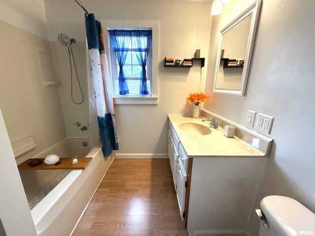 1300 S Duncan St, Marion, IL 62959 - bathroom featuring toilet, wood finished floors, vanity, shower / tub combo, and baseboards