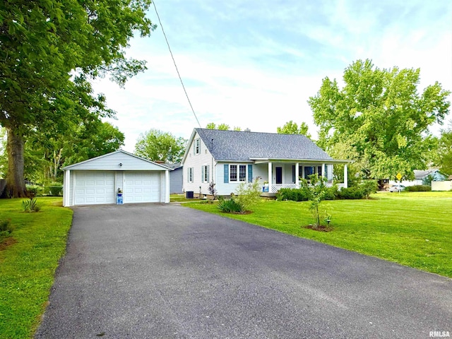 1300 S Duncan St, Marion, IL 62959 - view of front of property featuring covered porch, a detached garage, a front yard, an outbuilding, and a shingled roof
