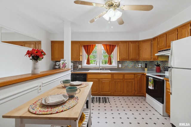 1300 S Duncan St, Marion, IL 62959 - kitchen featuring freestanding refrigerator, range with electric stovetop, under cabinet range hood, a sink, and tasteful backsplash