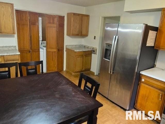415 Marteeny St, Mount Vernon, IL 62864 - kitchen featuring stainless steel fridge, brown cabinetry, and light countertops