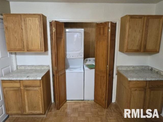 415 Marteeny St, Mount Vernon, IL 62864 - laundry room featuring stacked washer / drying machine