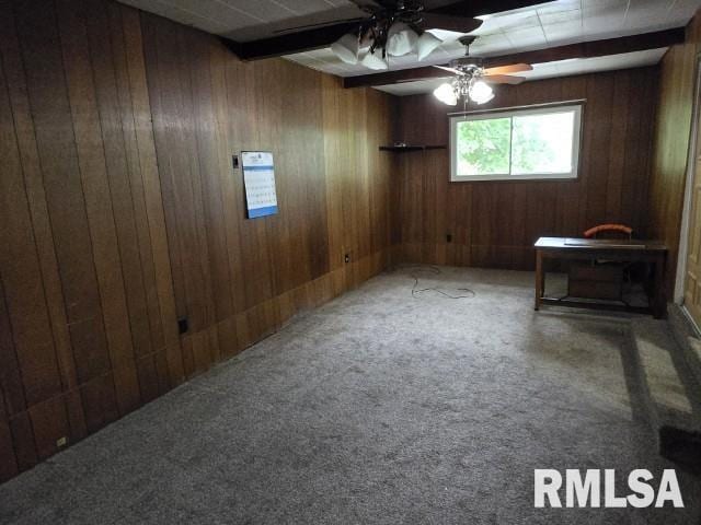 415 Marteeny St, Mount Vernon, IL 62864 - unfurnished room featuring wood walls, ceiling fan, and carpet