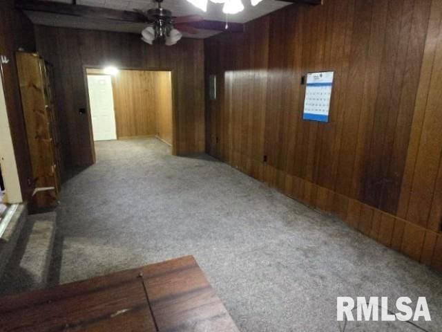 415 Marteeny St, Mount Vernon, IL 62864 - carpeted spare room with ceiling fan and wood walls