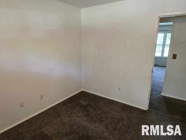 415 Marteeny St, Mount Vernon, IL 62864 - unfurnished room featuring dark colored carpet and baseboards