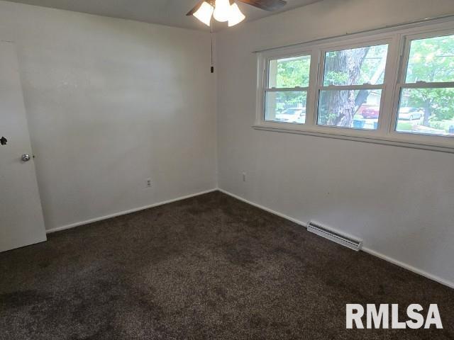 415 Marteeny St, Mount Vernon, IL 62864 - spare room with carpet floors, a ceiling fan, and baseboards