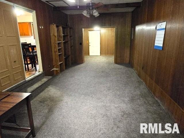 415 Marteeny St, Mount Vernon, IL 62864 - carpeted spare room with wooden walls and a ceiling fan