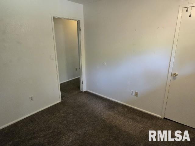 415 Marteeny St, Mount Vernon, IL 62864 - unfurnished room with dark carpet and baseboards