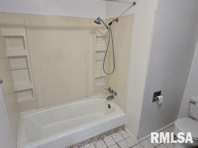 415 Marteeny St, Mount Vernon, IL 62864 - bathroom with tile patterned floors, toilet, shower / washtub combination, and baseboards