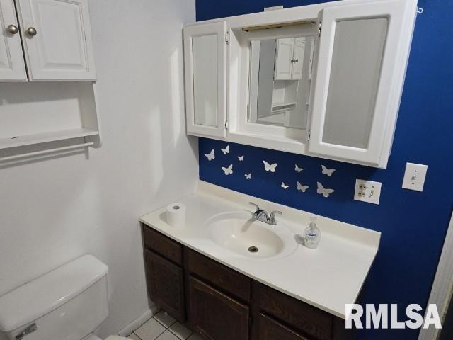 415 Marteeny St, Mount Vernon, IL 62864 - bathroom featuring vanity, toilet, and tile patterned flooring