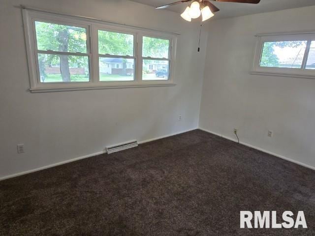 415 Marteeny St, Mount Vernon, IL 62864 - spare room featuring ceiling fan, dark colored carpet, and baseboards