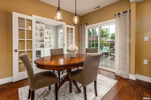 213 Texas Ave, Carterville, IL 62918 - dining room featuring baseboards and dark wood-type flooring