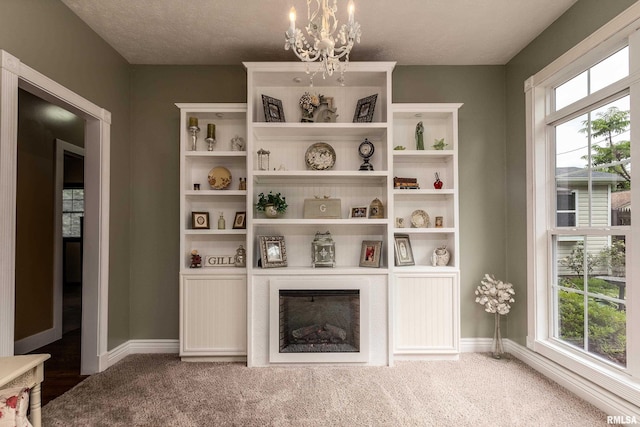 213 Texas Ave, Carterville, IL 62918 - detailed view of a chandelier, baseboards, and carpet floors