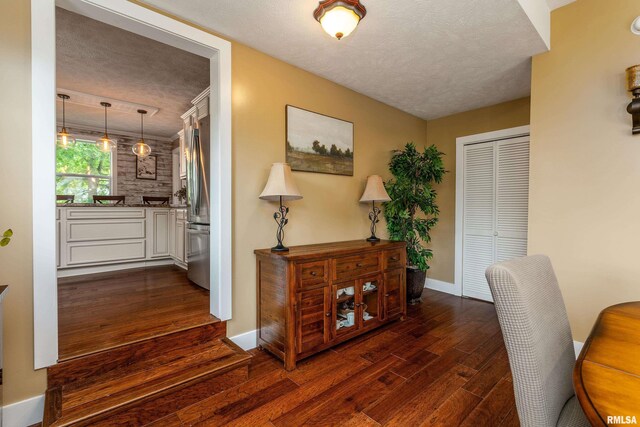 213 Texas Ave, Carterville, IL 62918 - office space with dark wood-type flooring, a textured ceiling, and baseboards