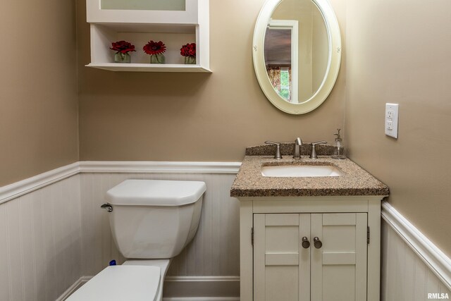 213 Texas Ave, Carterville, IL 62918 - bathroom featuring wainscoting, toilet, and vanity