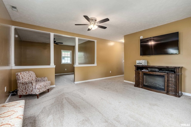 213 Texas Ave, Carterville, IL 62918 - living area with a ceiling fan, carpet, and baseboards