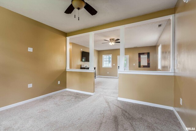 213 Texas Ave, Carterville, IL 62918 - unfurnished living room featuring a ceiling fan, carpet, and baseboards