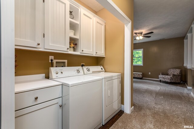 213 Texas Ave, Carterville, IL 62918 - laundry area featuring cabinet space, washing machine and dryer, ceiling fan, dark colored carpet, and baseboards