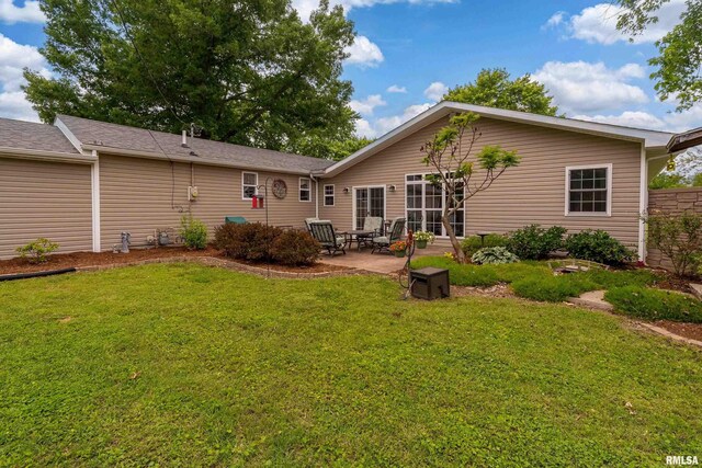 213 Texas Ave, Carterville, IL 62918 - back of house featuring a yard and a patio