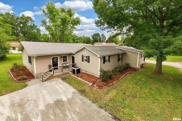 213 Texas Ave, Carterville, IL 62918 - ranch-style house featuring driveway, a front yard, a shingled roof, and central AC