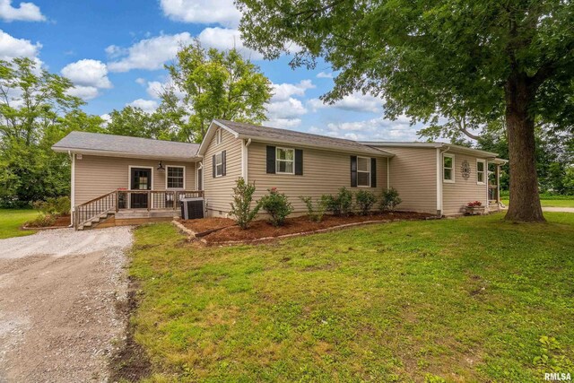 213 Texas Ave, Carterville, IL 62918 - ranch-style house featuring cooling unit, a front yard, and dirt driveway