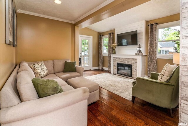 213 Texas Ave, Carterville, IL 62918 - living room featuring ornamental molding, healthy amount of natural light, wood finished floors, a glass covered fireplace, and baseboards